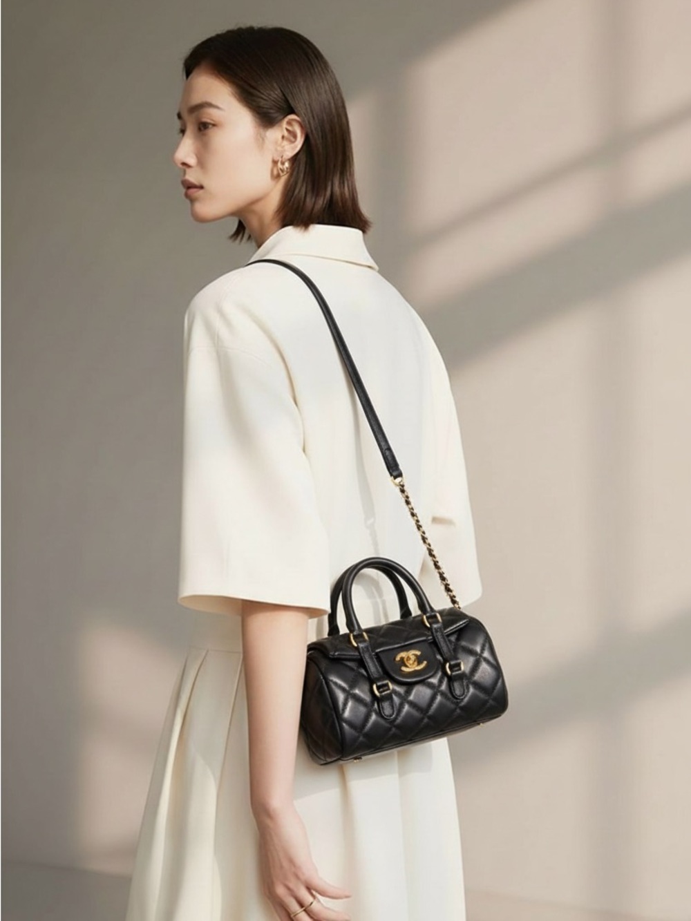 CHANEL Black Quilted Mini Barrel Bag with Gold CC Hardware